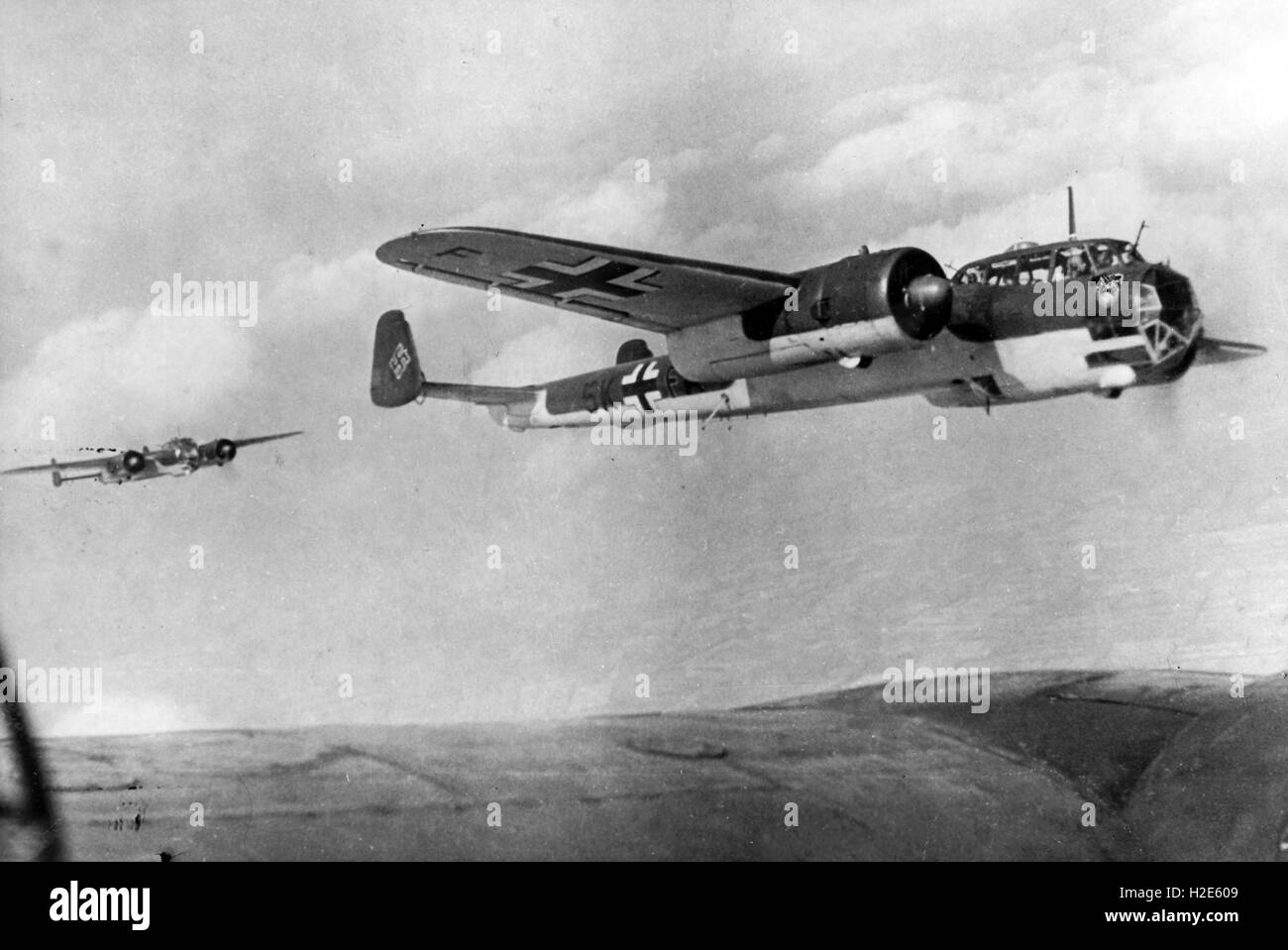 The Nazi propaganda image depicts a combat aircraft, type Junker Ju 88. The photo was published in February 1943. The Nazi text on the back of the photo writes on 27 February 1943: 'On the occasion of the day of the Luftwaffe (German Airforce) on 1 March. A combat aircraft on duty'. Fotoarchiv für Zeitgeschichte - NO WIRE SERVICE -  | usage worldwide Stock Photo