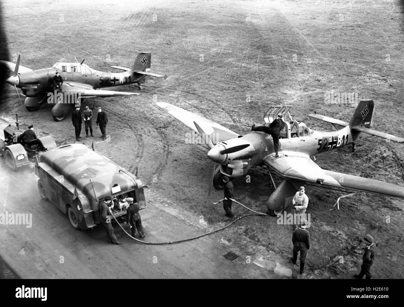 The Nazi propaganda image depicts soldiers of the German Wehrmacht refueling a combat airplane, type Junker Ju 87. The photo was published in January 1939. Fotoarchiv für Zeitgeschichte - NO WIRE SERVICE -  | usage worldwide Stock Photo