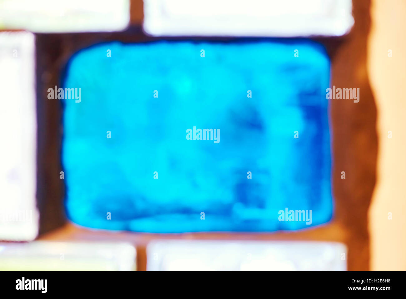 Blurred photo of glass blocks, abstract background. Stock Photo
