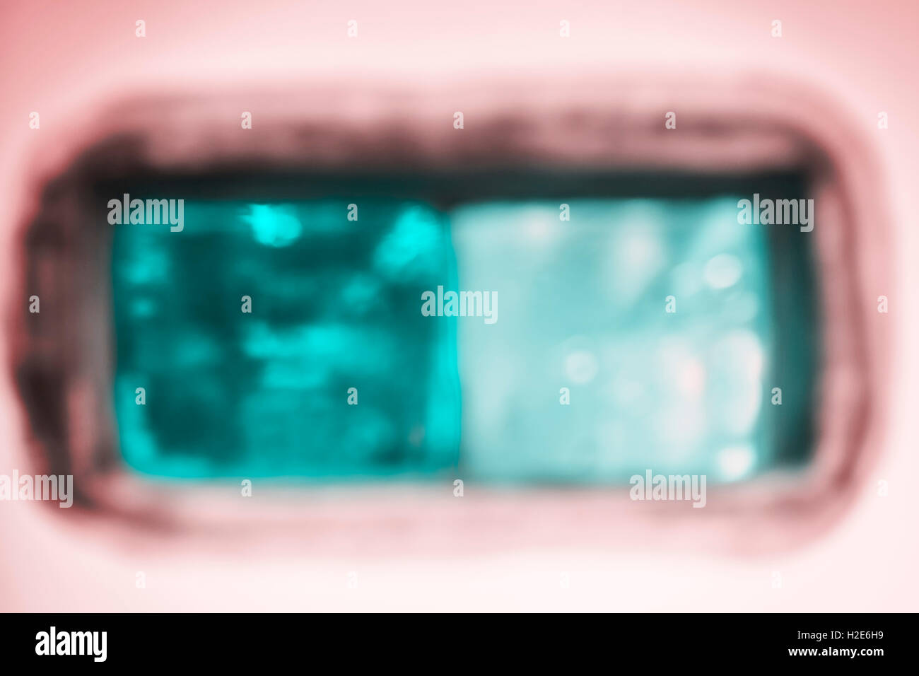 Blurred photo of glass blocks, abstract background. Stock Photo