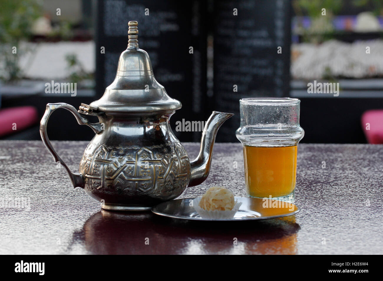 Moroccan silver teapot, glass of mint tea, Marrakesh, Morocco Stock