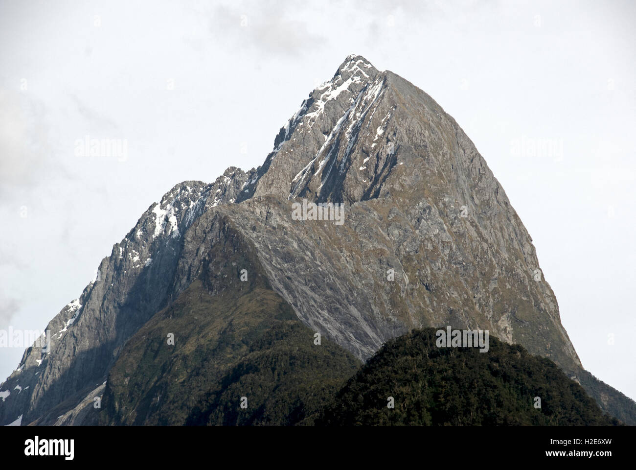 Mitre Peak (Māori Rahotu) on a clear Spring morning at Milford Sound, Fiordland National Park. Stock Photo
