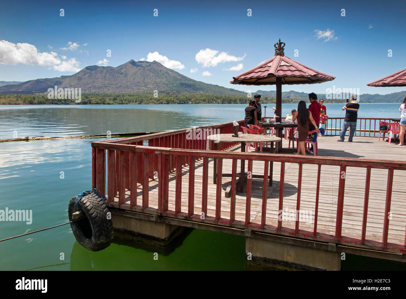 Indonesia, Bali, Kedisan, Gunung Batur from Floating Hotel on inner crater lake, customers on pontoon Stock Photo