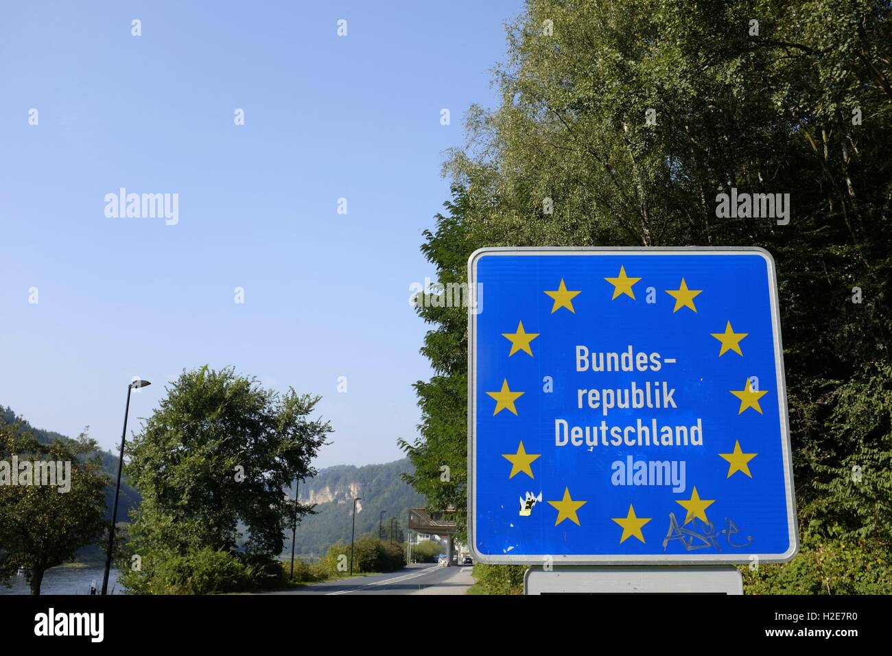 border crossing sign germany - Bundesrepublik Deutschland , entering the federal republic of germany - on a sunny day | usage worldwide Stock Photo