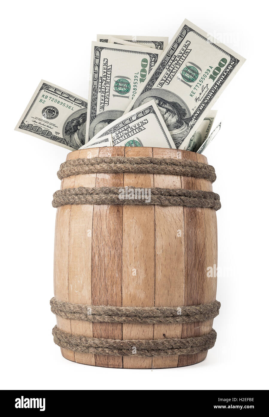 Wooden barrel with hundred dollar bills Stock Photo