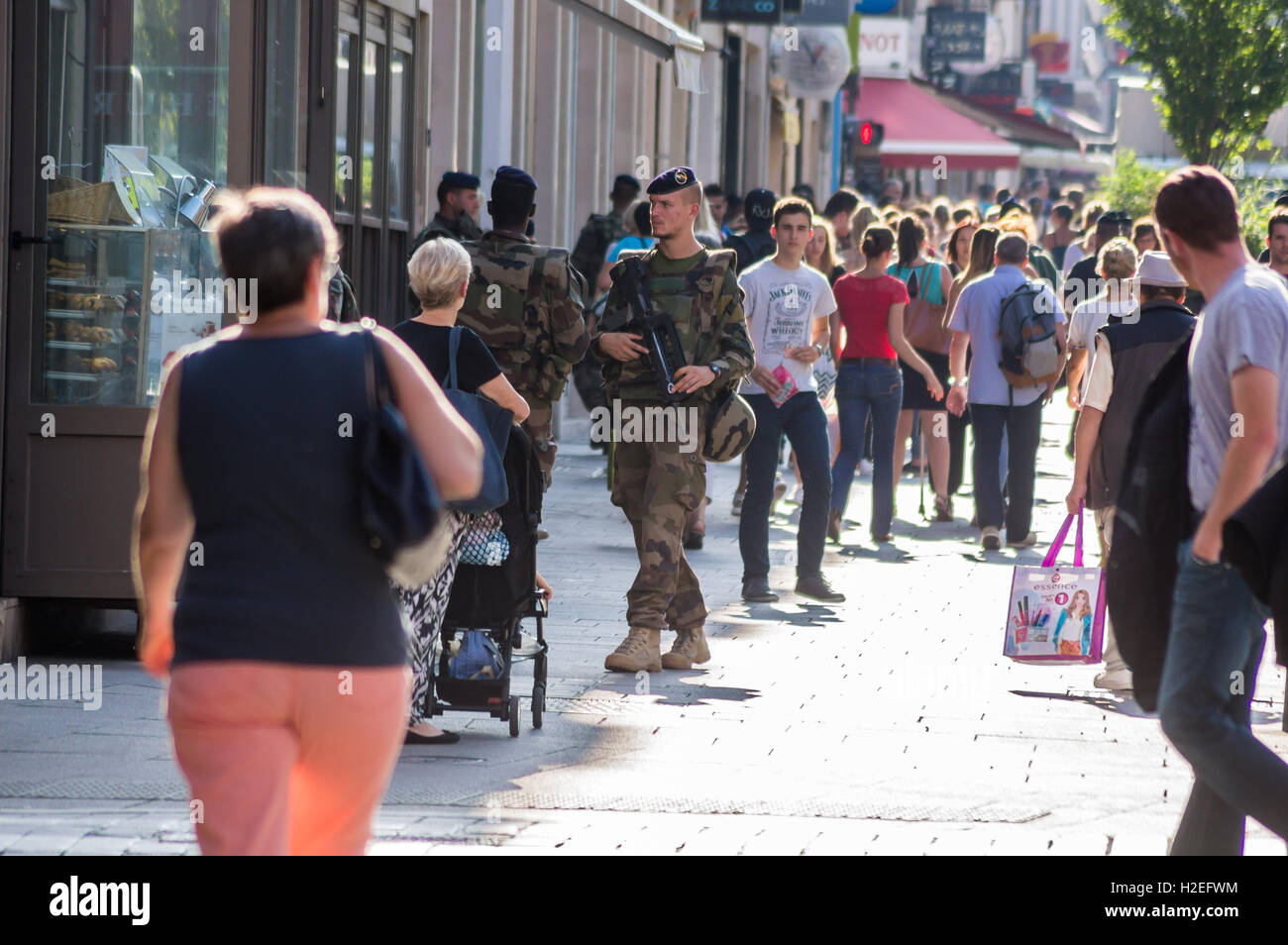 A Eurocorps soldier armed with  FAMAS F1 rifle on anti-terrorist patrol, Rue des Dominicains, Nancy, Meurthe-et Moselle, (Grand Est),France Stock Photo