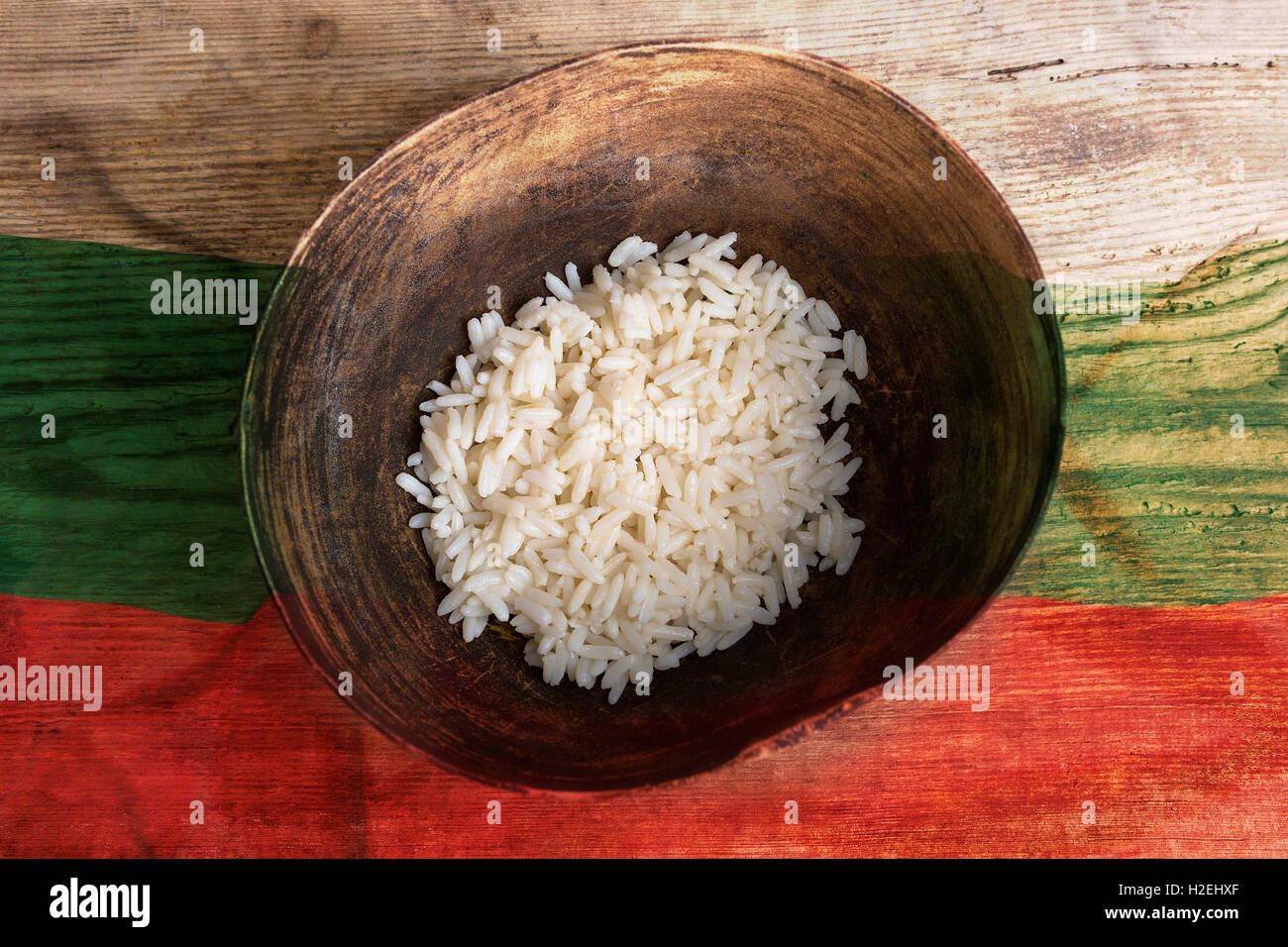Poverty concept, bowl of rice with Bulgaria flag on wooden background ...
