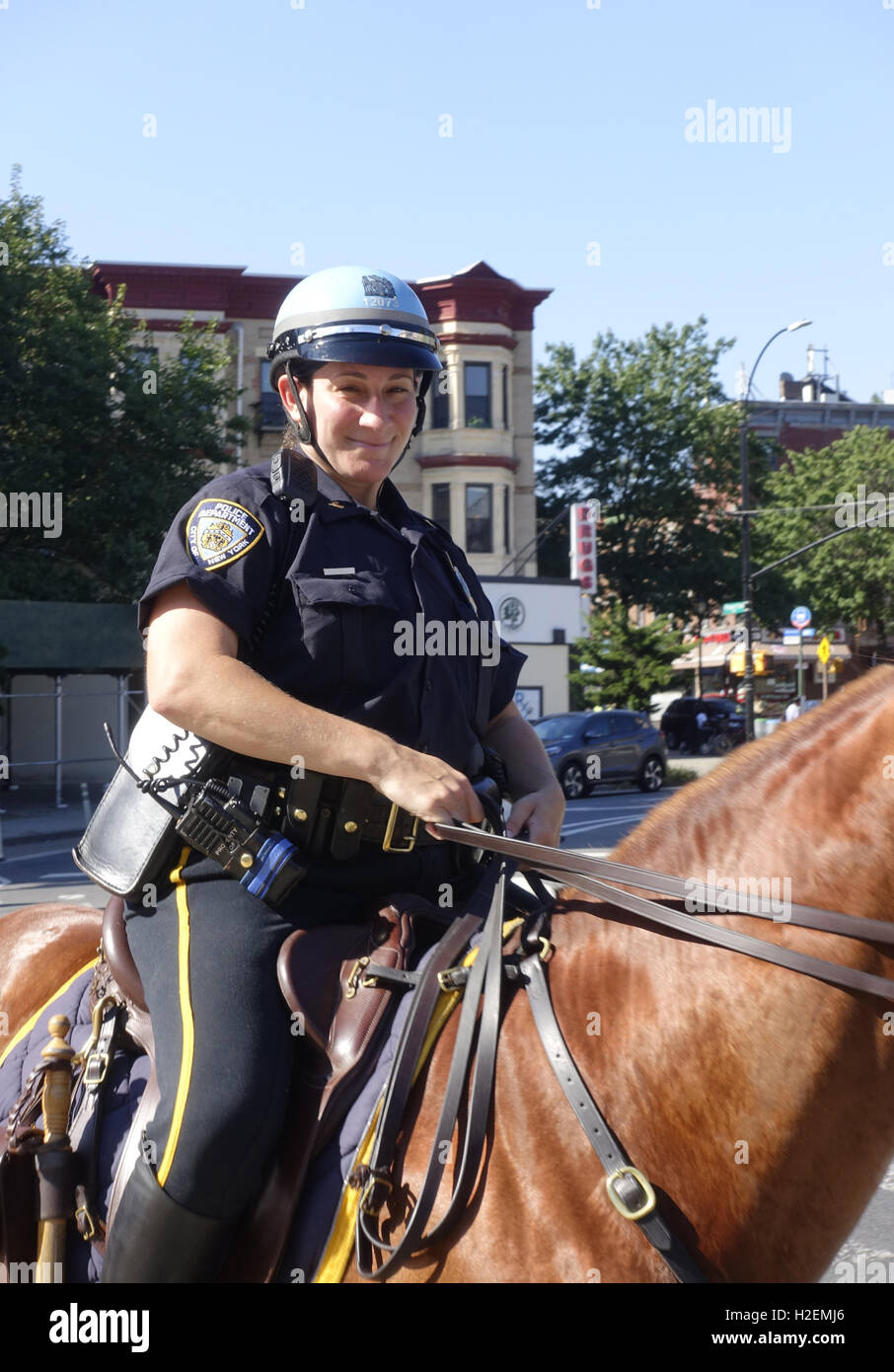 Female NYPD police officer on horseback patrolling Prospect Park, Brooklyn, New York. Stock Photo