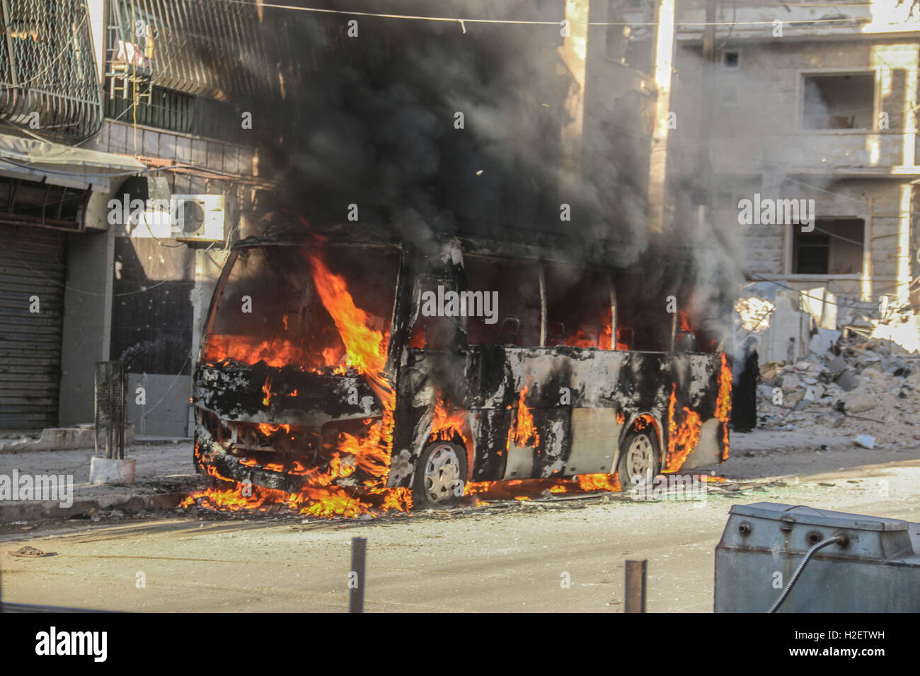 September 25, 2016 - Aleppo, Syria - Syrian jets have attacked the besieged town of Aleppo with cluster bombs, causing several deaths and injures and much burning. (Credit Image: © Basem Ayoubi/ImagesLive via ZUMA Wire) Stock Photo