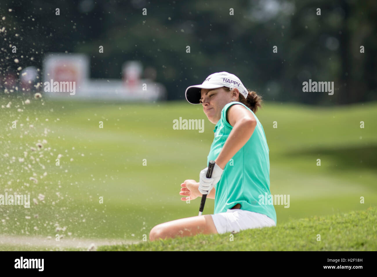 Kuala Lumpur, Malaysia. 28th Oct, 2016. Beatriz Recari landed her shot on the side of hilly green bunker. A good effort to hit the ball out from the bunker to the green. Credit:  Danny Chan/Alamy Live News. Stock Photo