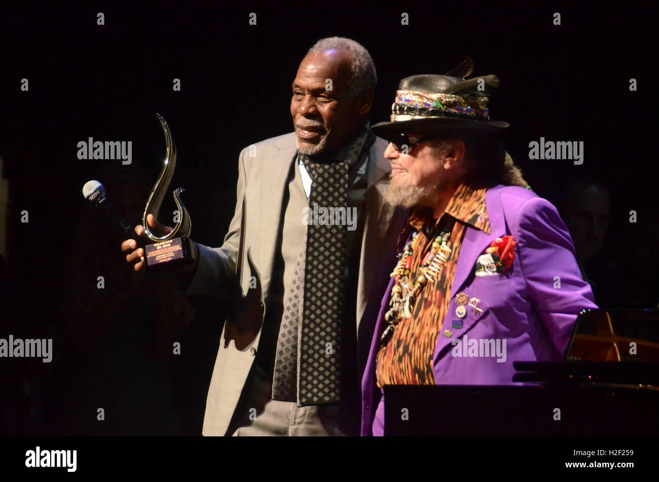 Harlem, NY, USA. 27th Oct, 2016. Dr. John receives the Hank Jones Award from Danny Glover at The Jazz Foundation of America Presents the 15th Annual 'A Great Night in Harlem' Gala Concert to Benefit Their Jazz Musicians Emergency Fund Saving Jazz, Blues and R & B.One Musician at a Time - Red Carpet at The Apollo Theater on October 27, 2016 in New York City. © Raymond Hagans/Media Punch/Alamy Live News Stock Photo