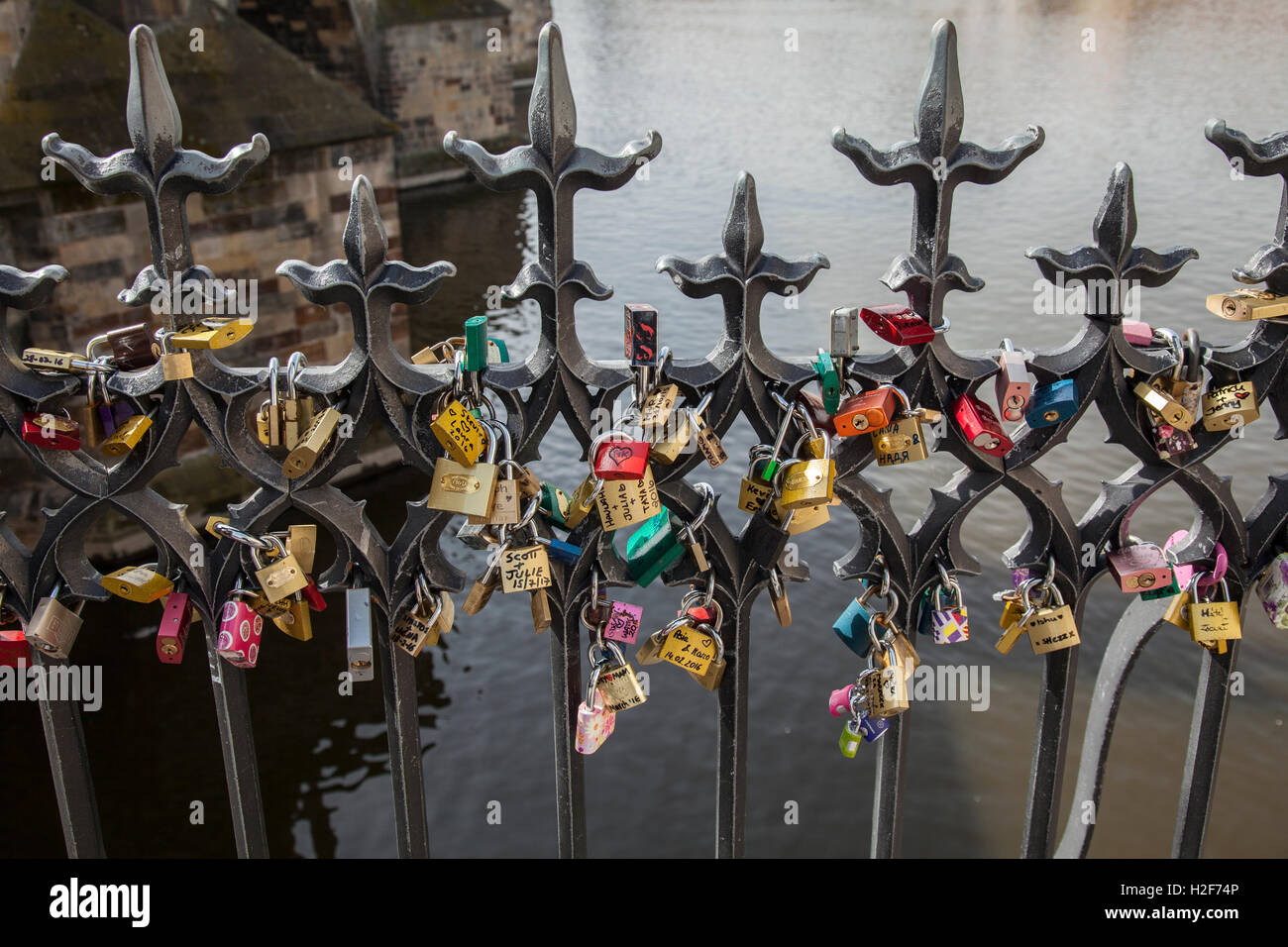 Love locks on railings next to Charles Bridge Prague Stock Photo