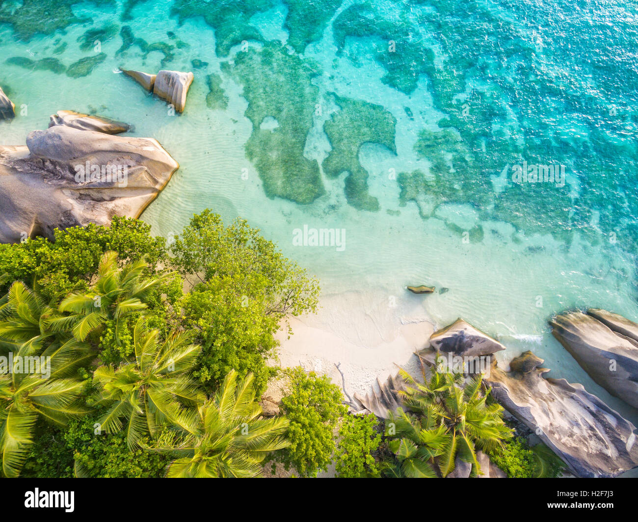 Aerial photo of Seychelles tropical beach Anse Source D Argent at La Digue island Stock Photo