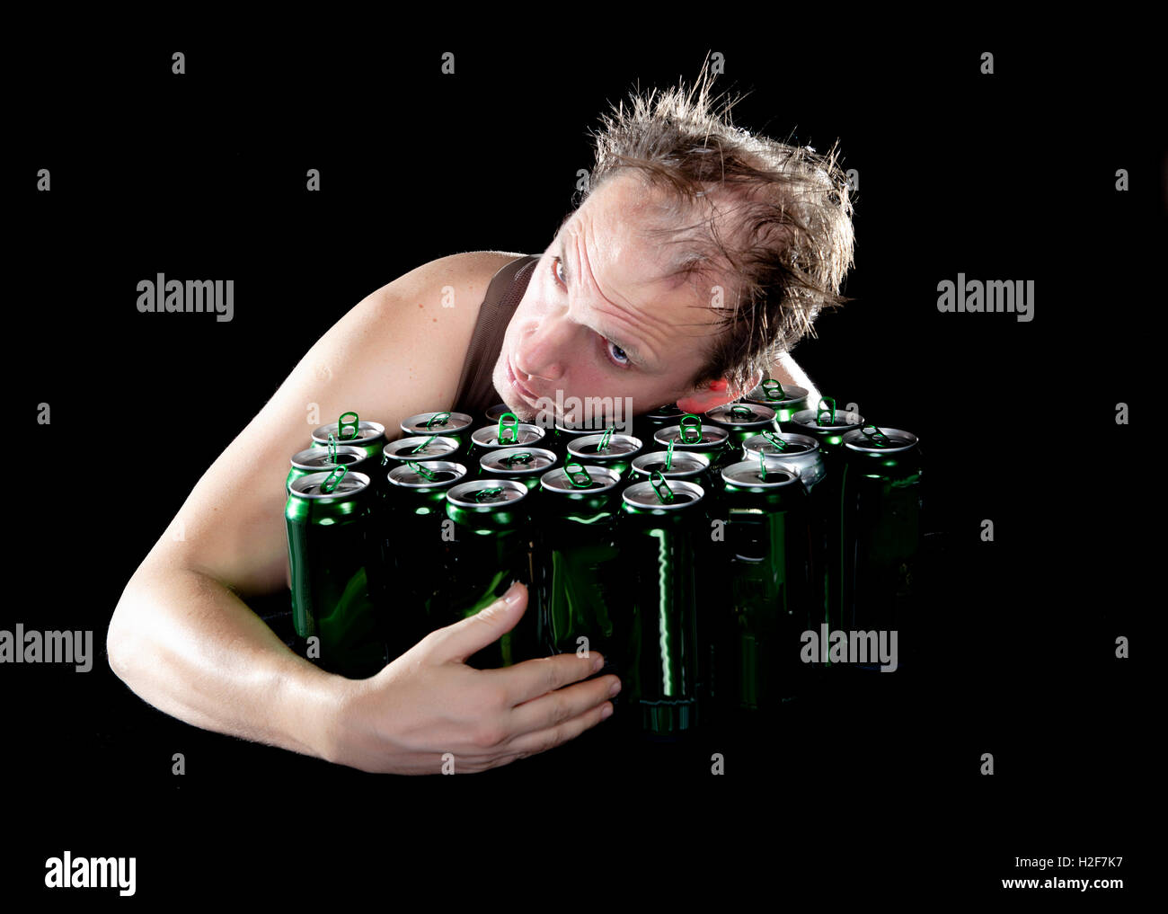 Hangover.The drunk man and is a lot of empty beer cans Stock Photo Alamy