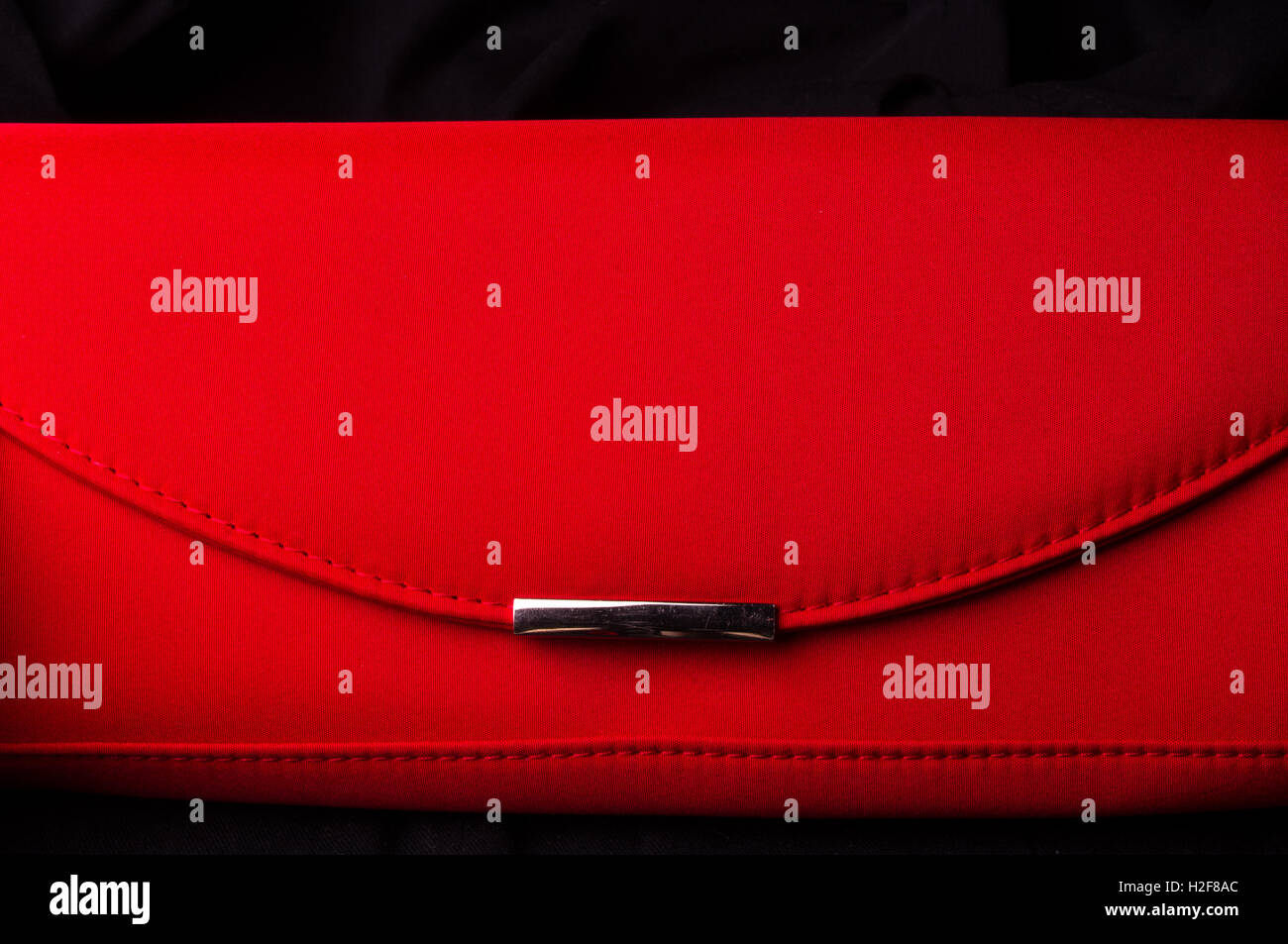 closeup of the little women's handbag - clutch bag from red fabric Stock Photo