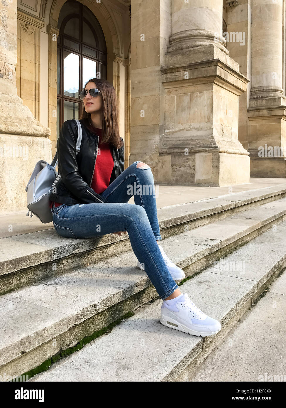 Woman Sitting Jeans Stock Photos and Images - 123RF