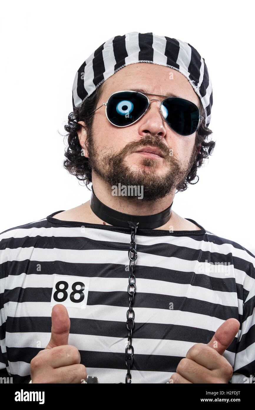 Prison, one caucasian man prisoner criminal with chain ball and Stock