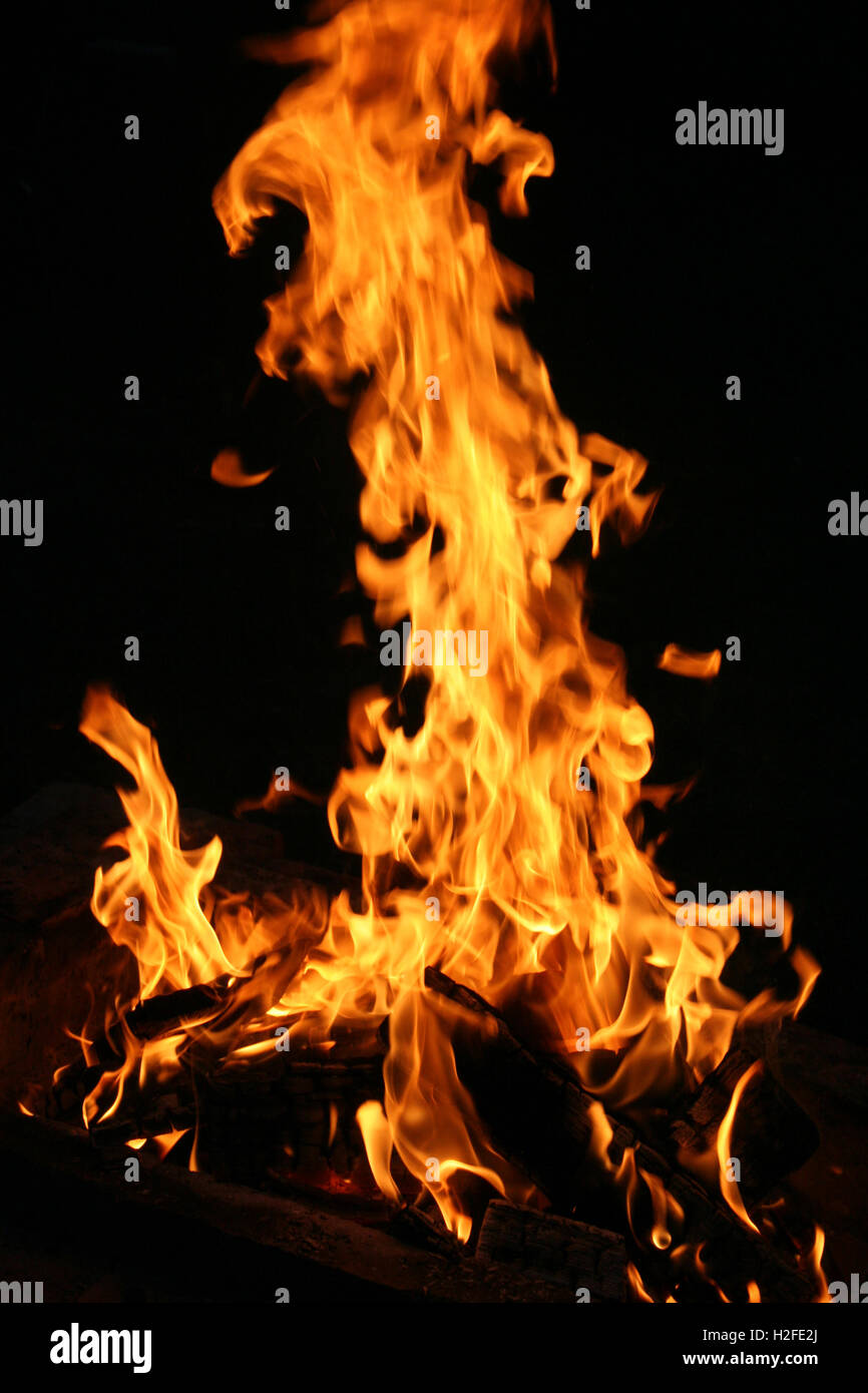 Abstract background or backdrop representing fire or flame or campfire pattern with dark and light spots. Stock Photo