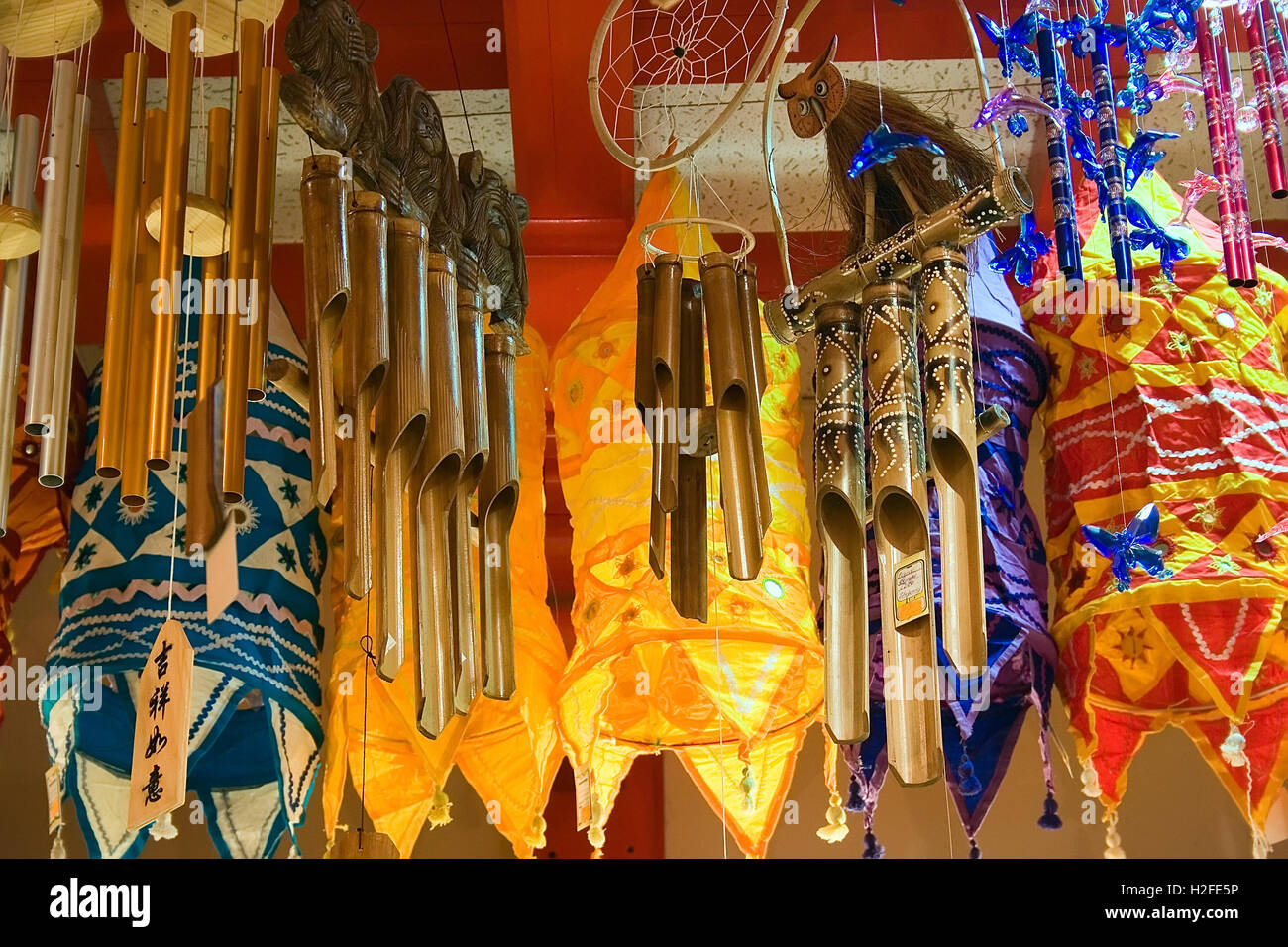 Wind chimes and fairy lights in a souvenir shop for sale. Landscape orientation. Stock Photo