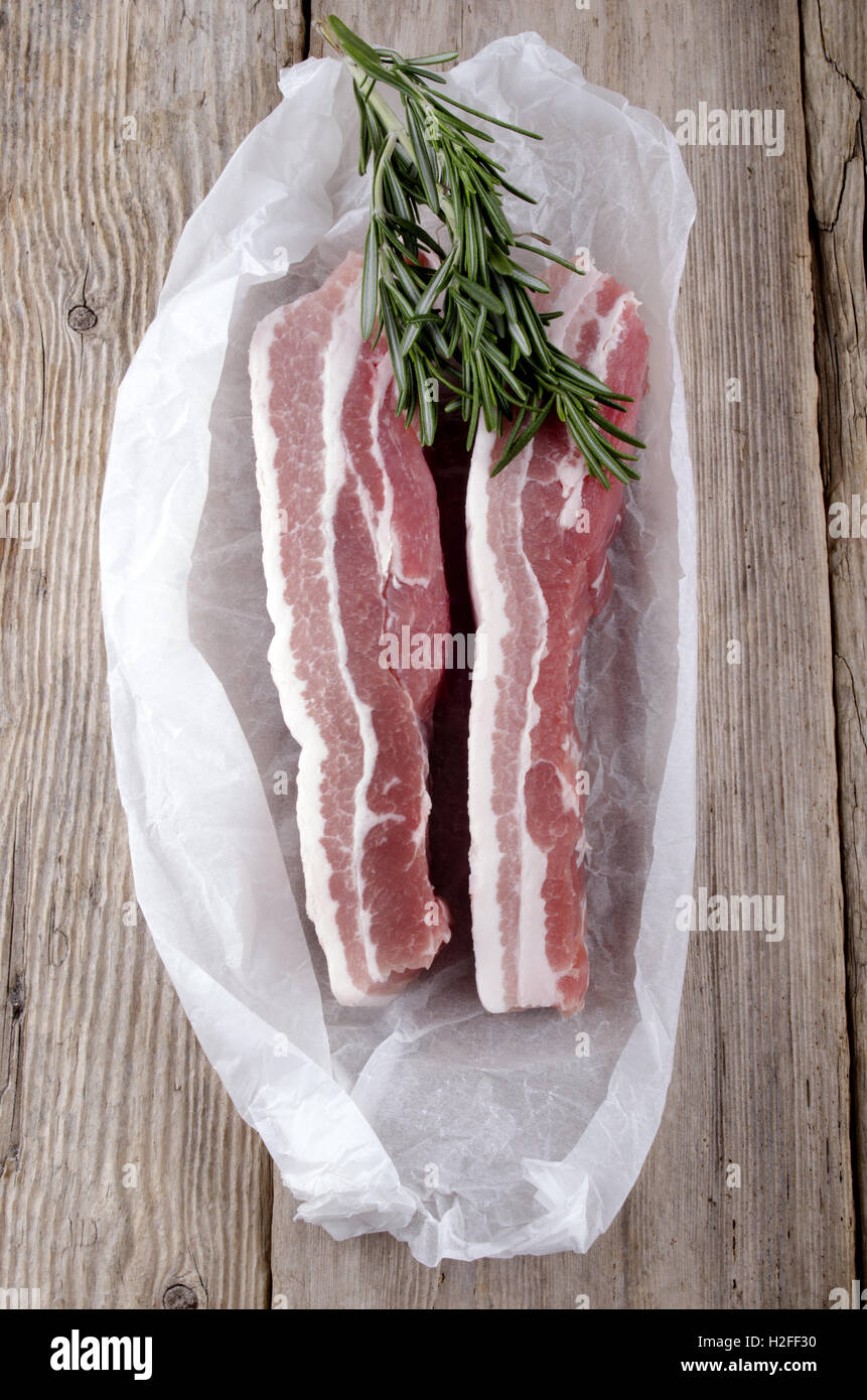 raw pork belly with rosemary Stock Photo Alamy