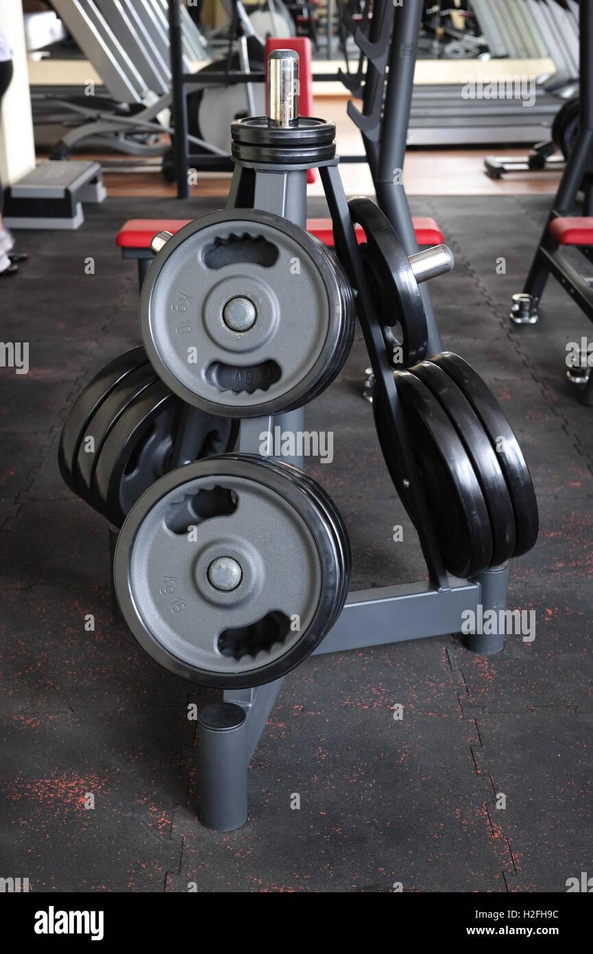 Barbell plates rack Stock Photo - Alamy