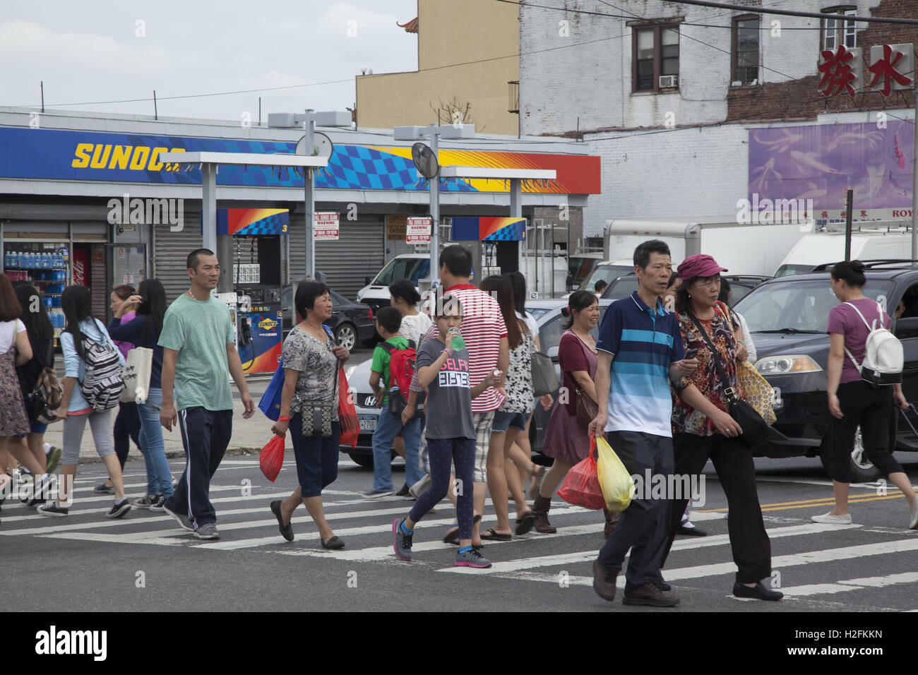 Mostly Chinese residents on 8th Avenue in the Chinatown neighborhood of