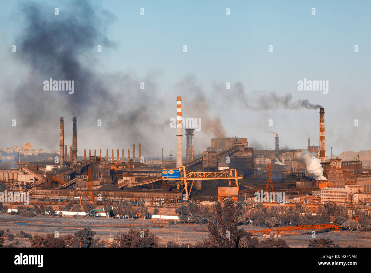 Steel mill, Metallurgy plant. Heavy industry. Steel factory with smog. Pipes with black smoke. Metallurgical plant. steel works, Stock Photo