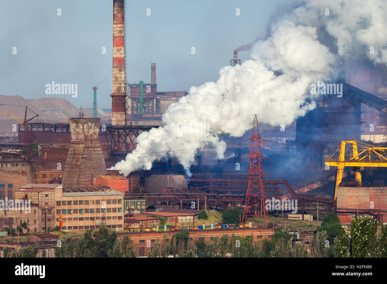 Steel mill, Metallurgy plant. Heavy industry factory. Steel factory with smog. Pipes with smoke. Metallurgical plant. steel work Stock Photo