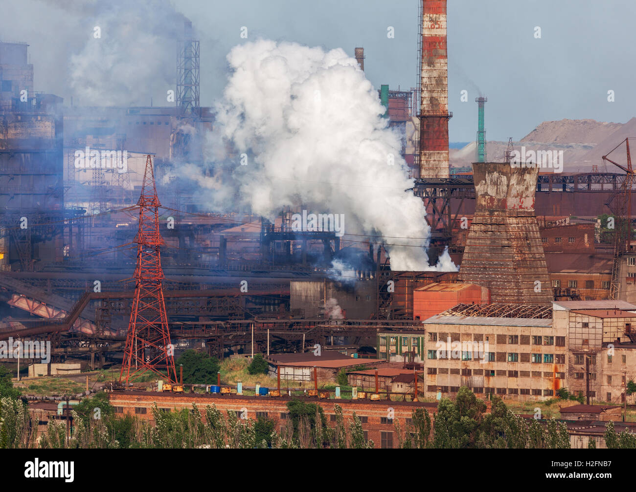 Steel mill, Metallurgy plant. Heavy industry factory. Steel factory with smog. Pipes with smoke. Metallurgical plant. steel work Stock Photo