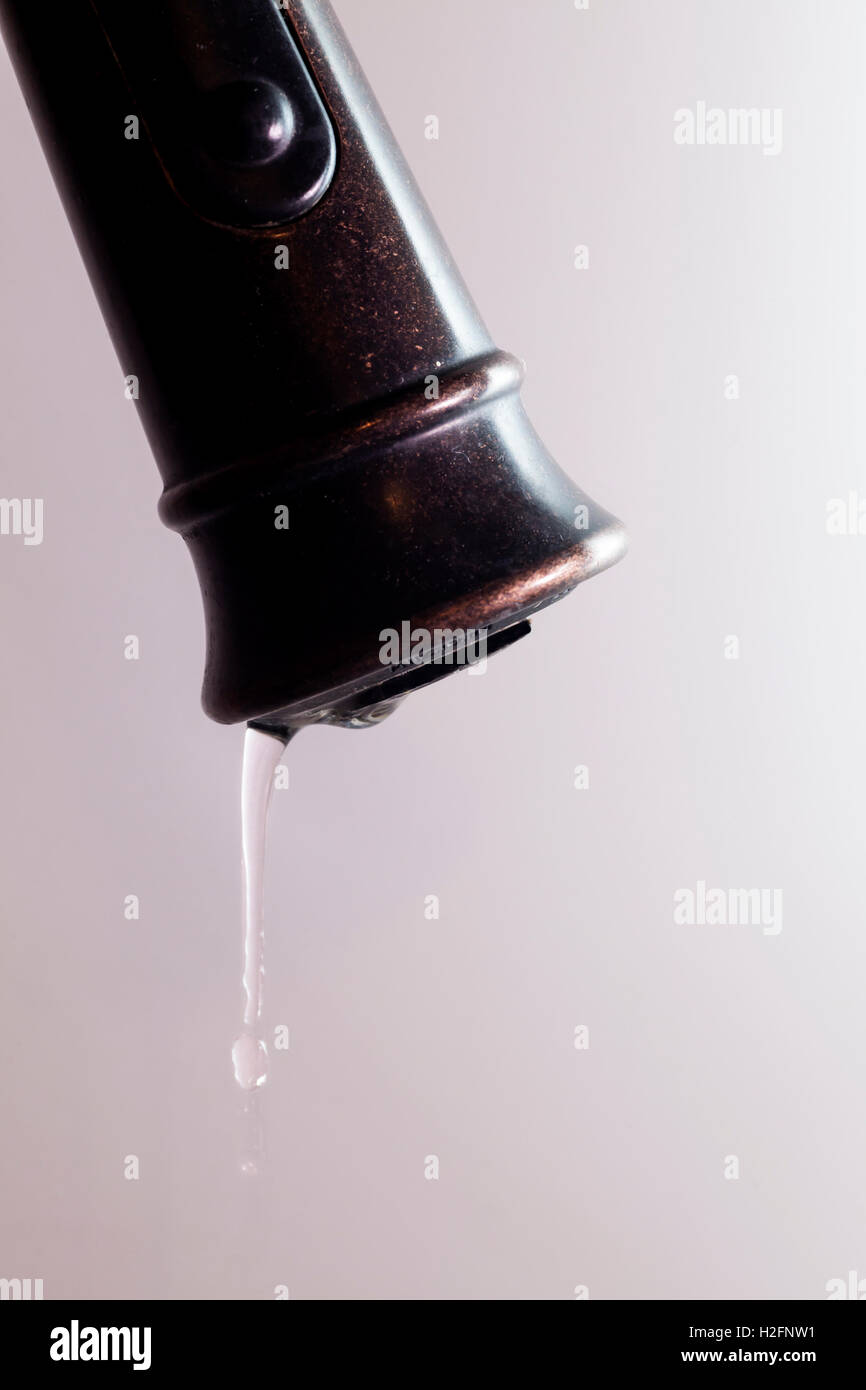 Closeup of a leaking faucet. Stock Photo