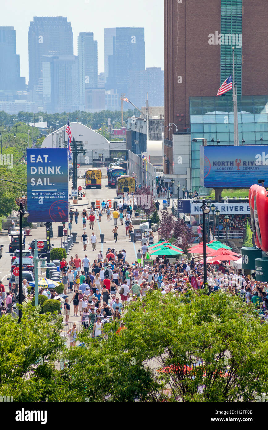 A view of New York City Pier 83 on the Hudson River filled with visitors and tourists Stock
