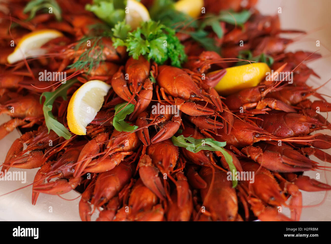 Red boiled crawfish with lemon Stock Photo
