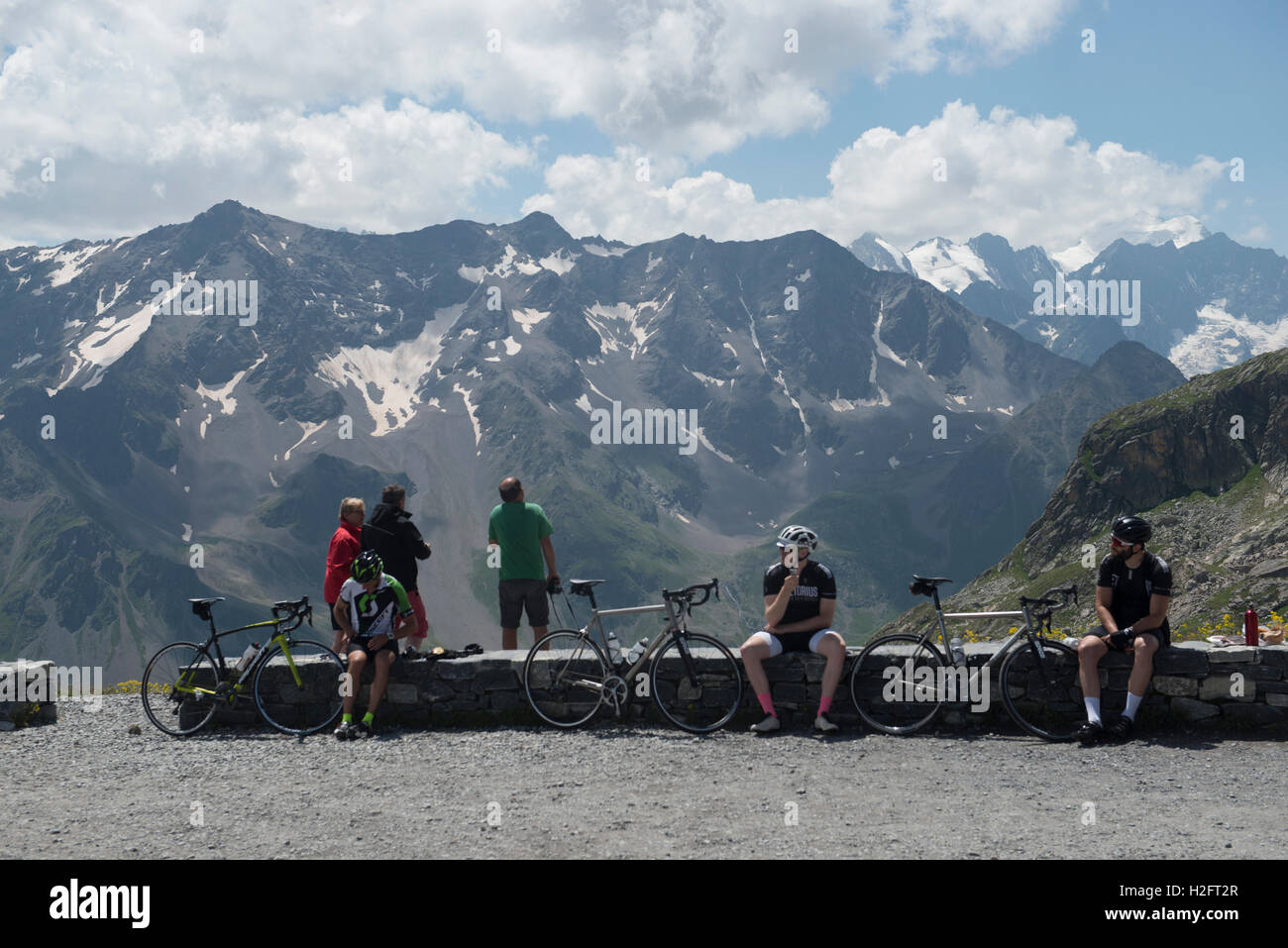 Cyclists resting on top of the Col de Galibier, French Alps, Provence-Alpes-Côte d'Azur, France Stock Photo