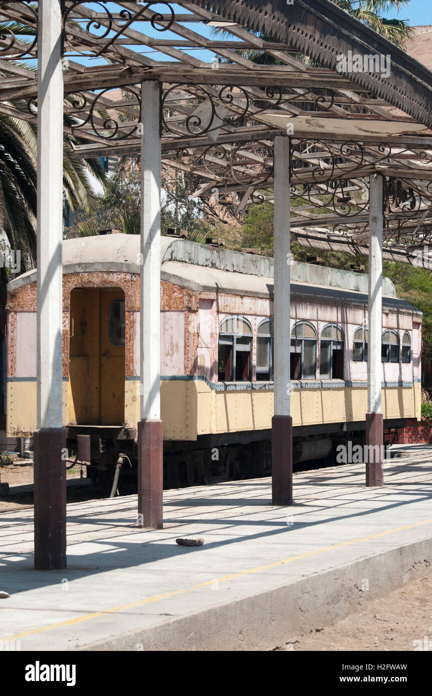 An abandoned carriage at the disused Arica station on the La Paz - Arica railway, linking Bolivia with the Pacific coast. Stock Photo