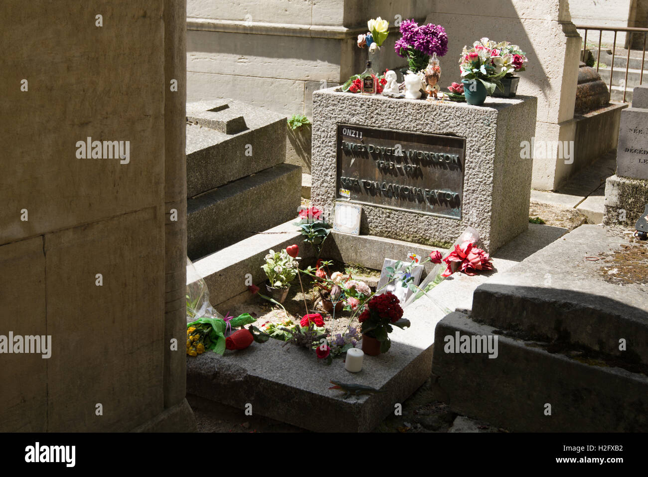 Grave of Jim Morrison, lead singer with the American 60's rock band The Doors located in Pére Lachaise cemetery in Paris Stock Photo