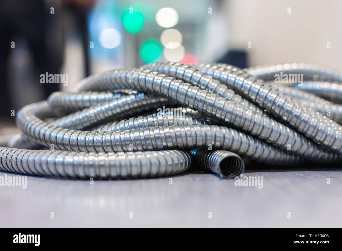 Flexible metal pipe on construction site. Stock Photo