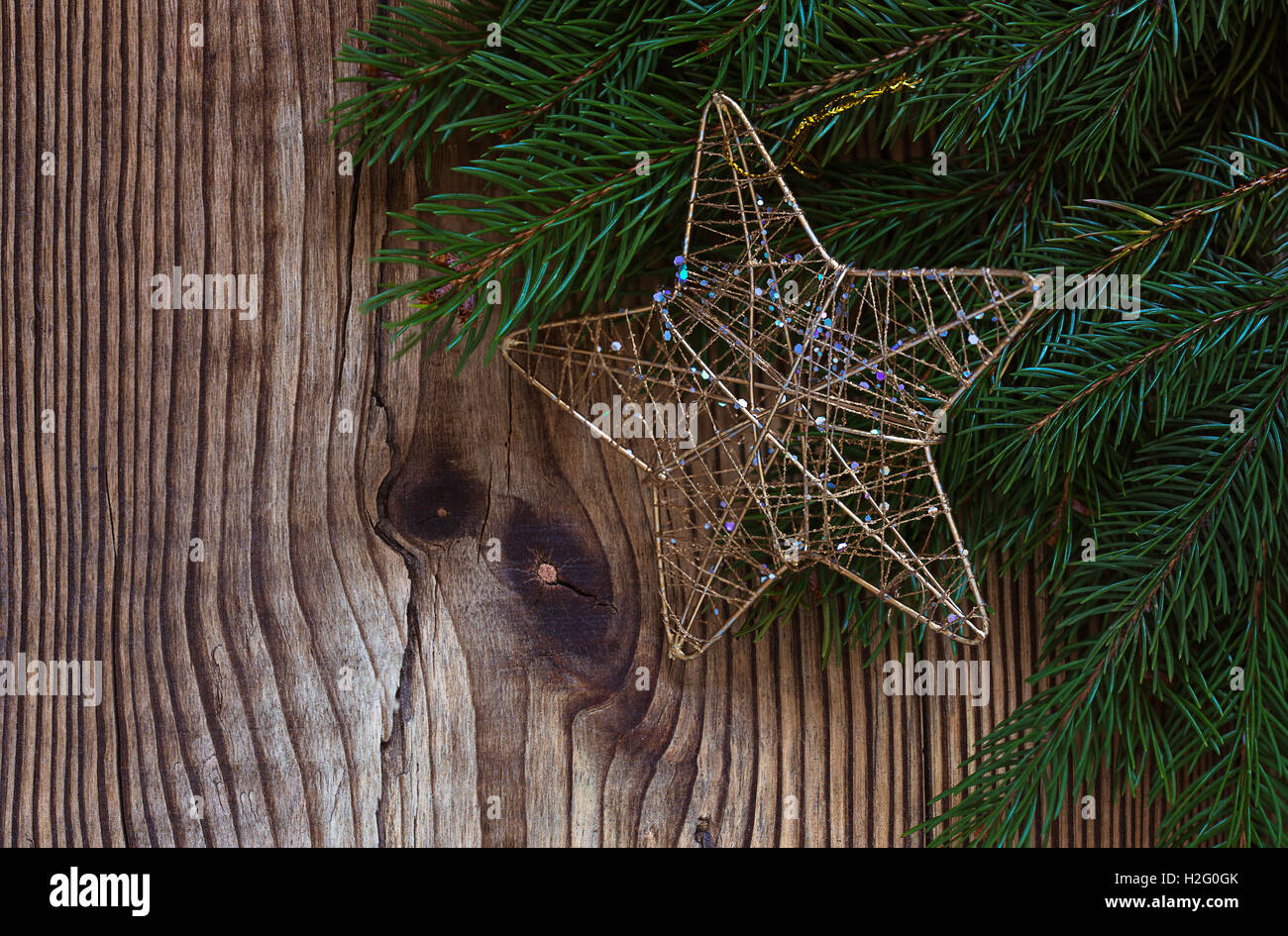 Christmas background with a pine branch and with a symbolic star on ...