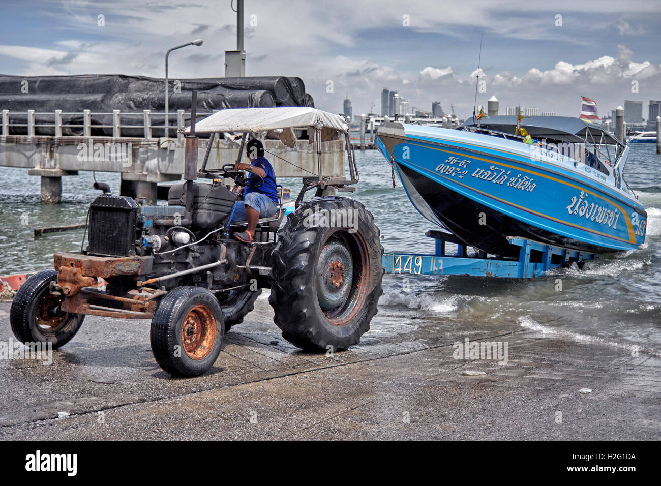 Tractor utiilised to remove boats from the water for dry storage. Thailand S. E. Asia Stock Photo