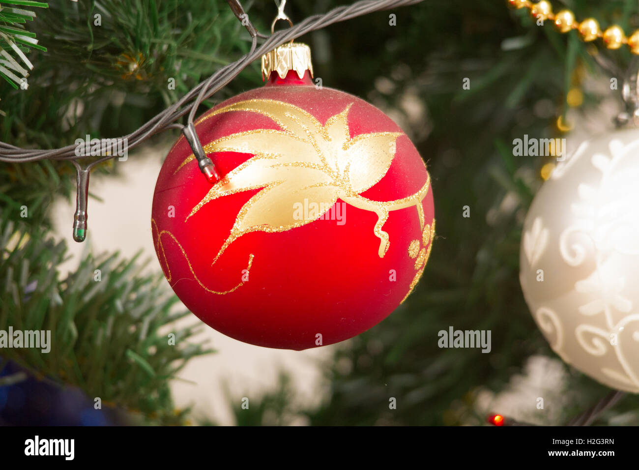 colorful Christmas decorations hung on the branches of trees Stock
