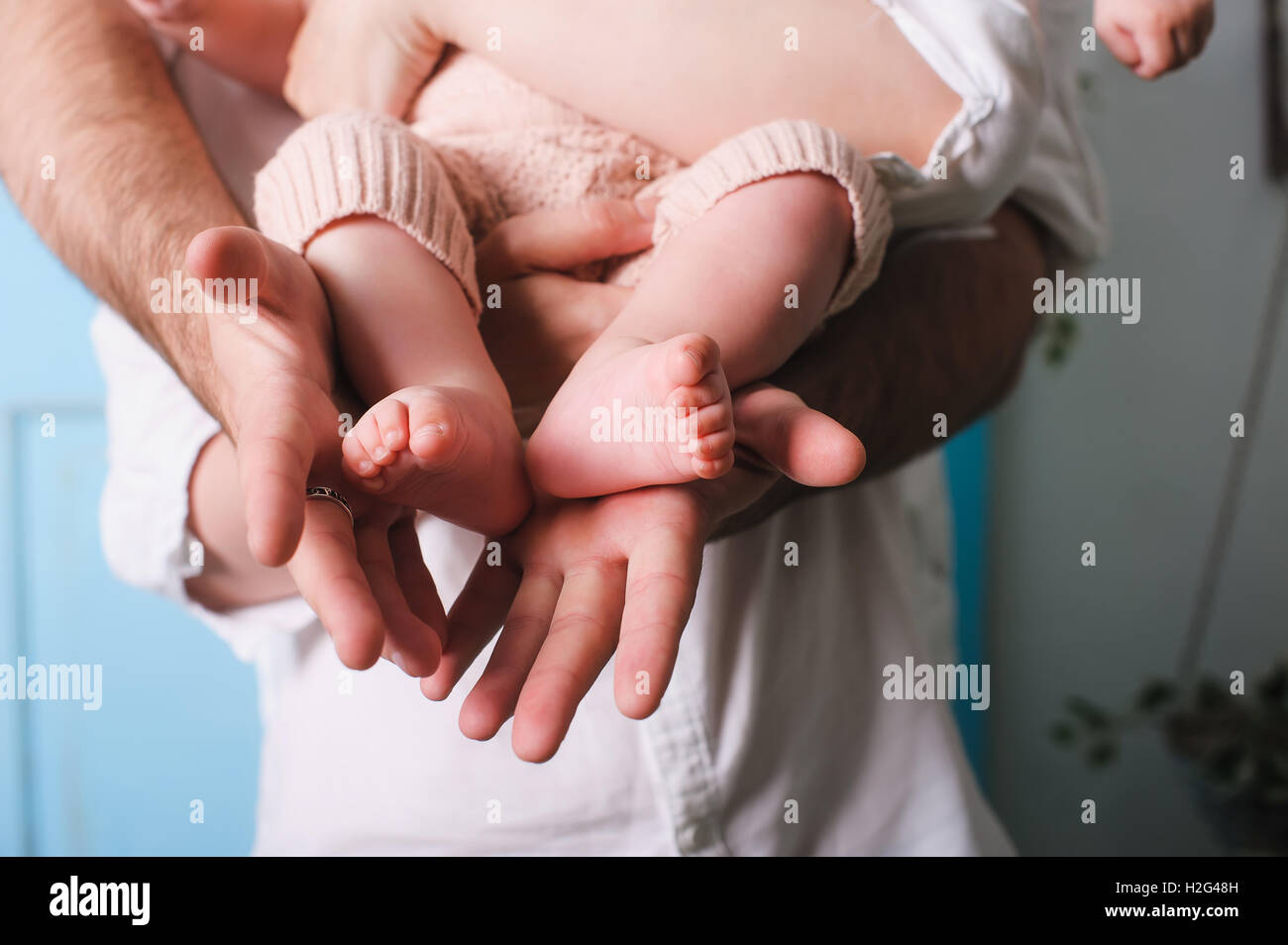 https://c8.alamy.com/comp/H2G48H/dad-holding-newborn-daughter-fathers-hands-holding-and-showing-his-H2G48H.jpg