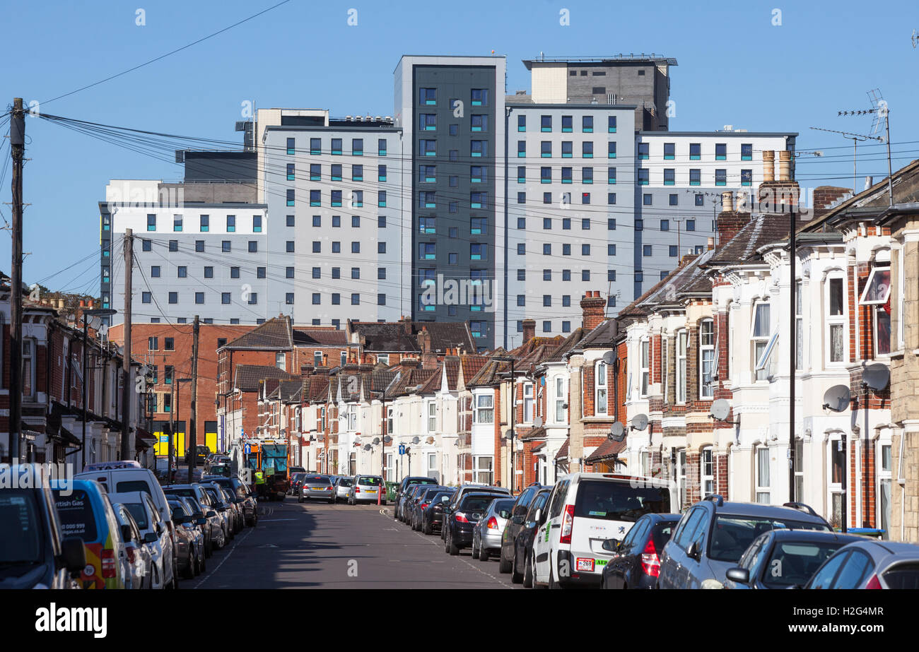New student accommodation 'Crescent Place' run by The Student Housing Company towering over terrace housing in Southampton, UK Stock Photo