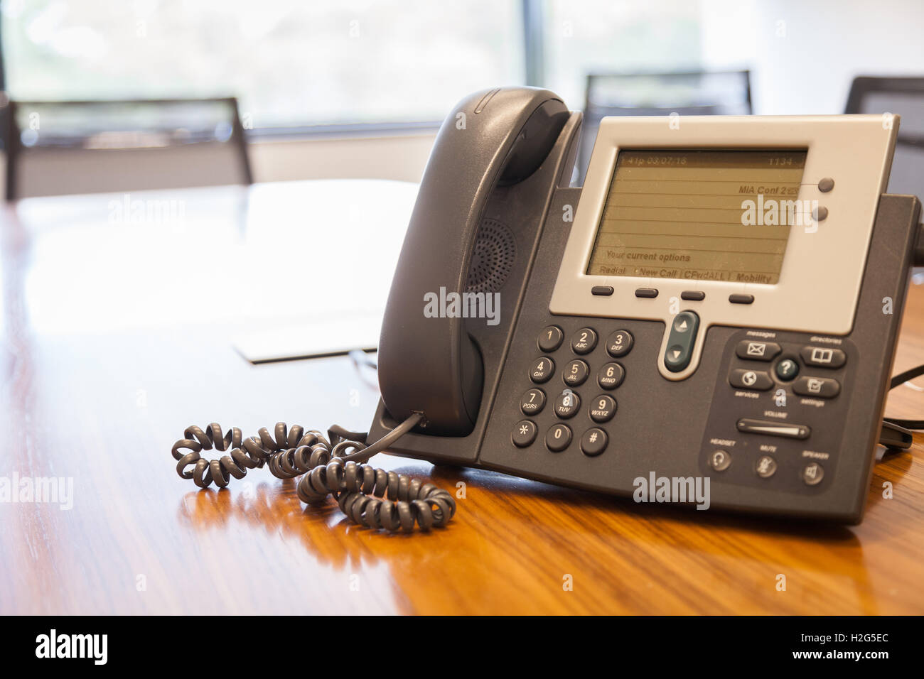 Telephone on table in conference room Stock Photo Alamy