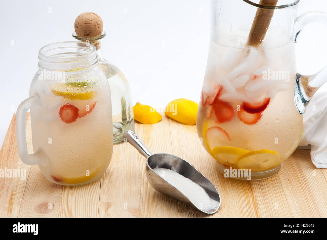 Tequila Lemonade with Strawberries and lime Stock Photo Alamy
