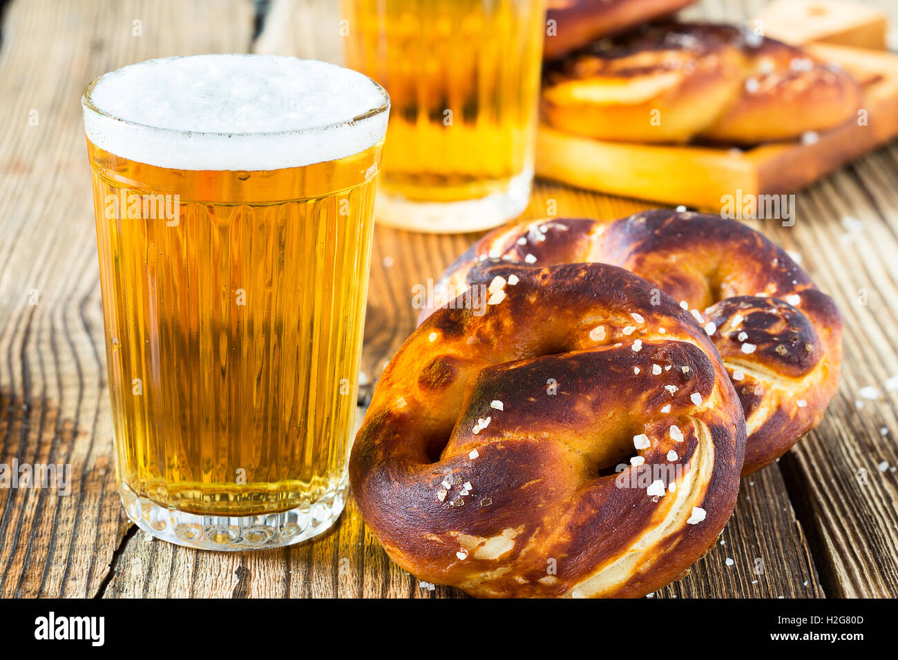 Refreshing beer ready to drink and fresh bavarian pretzels. Traditional