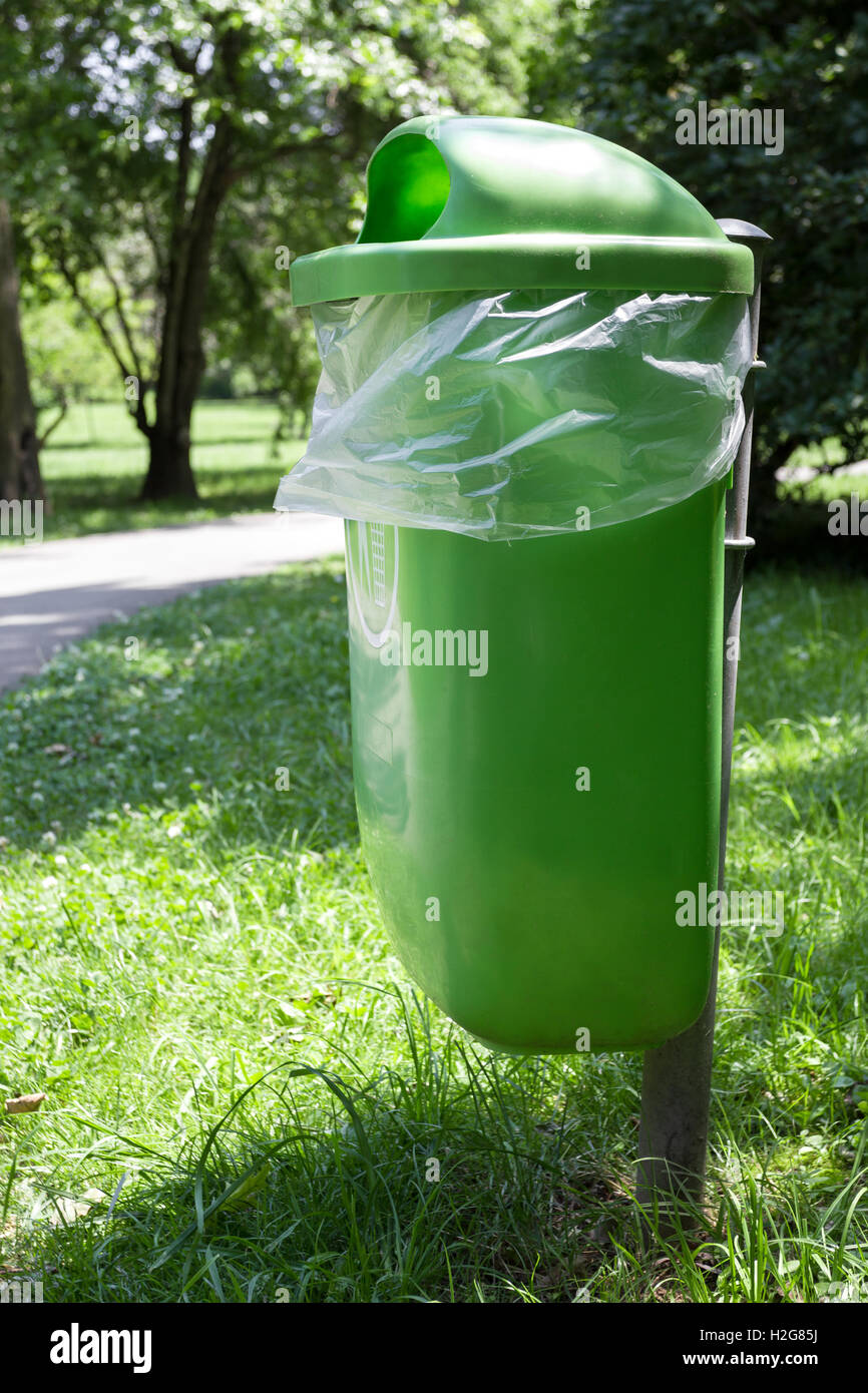 Green trash bin in the park Stock Photo Alamy