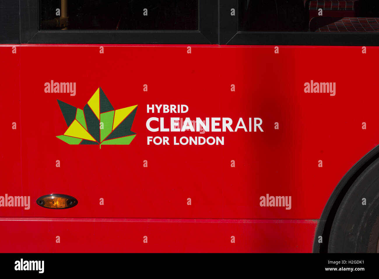 close up of a red London bus that is a hybrid for cleaner air in the capital city. Stock Photo
