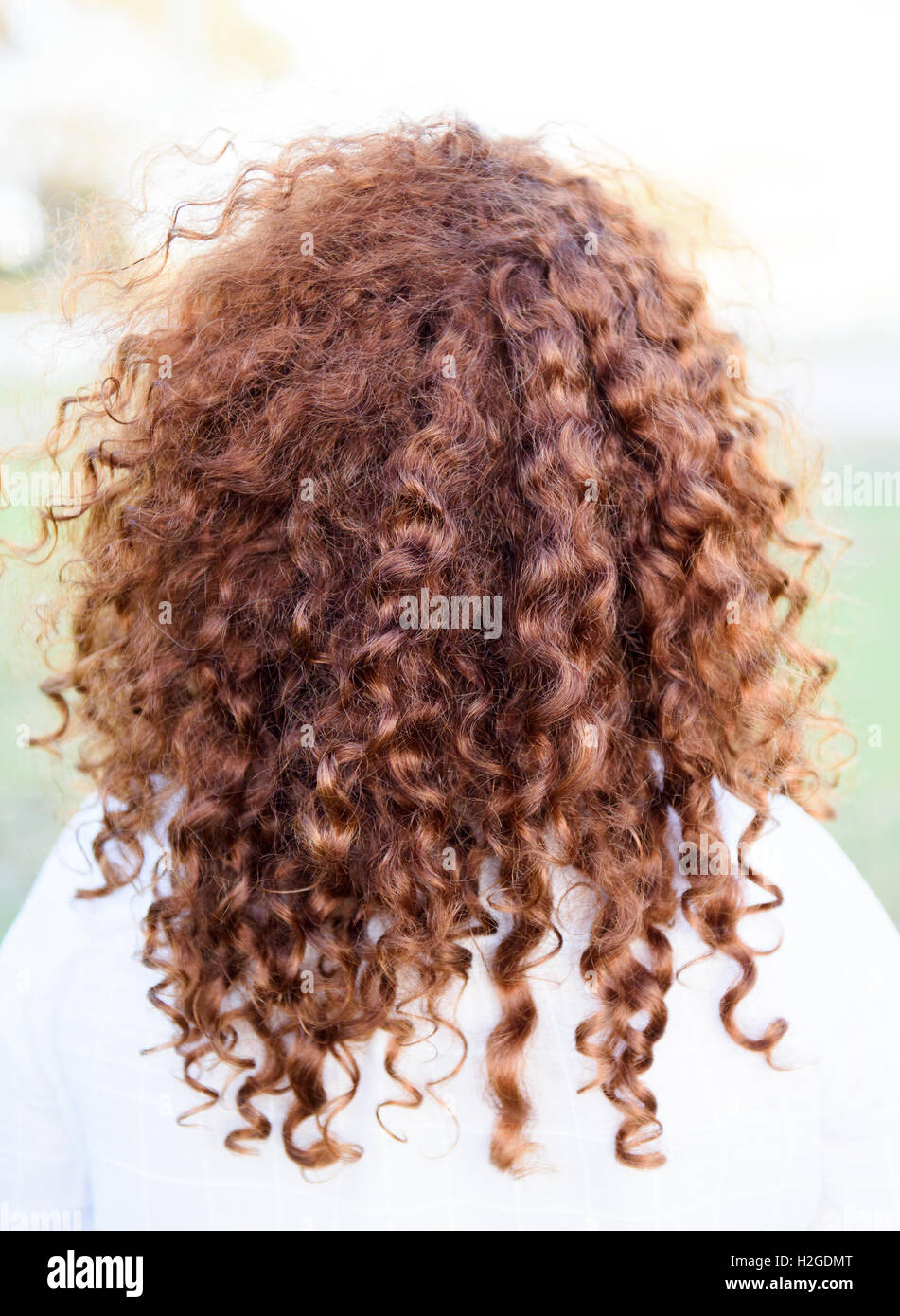 Girl with red curly hair Stock Photo