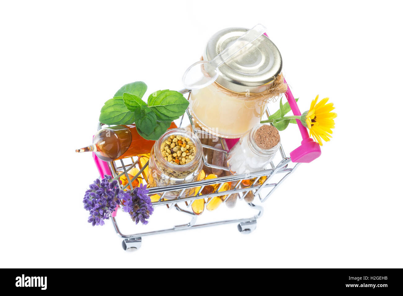 Alternative health care fresh herbal ,honey and wild flower in a supermatket troley Stock Photo