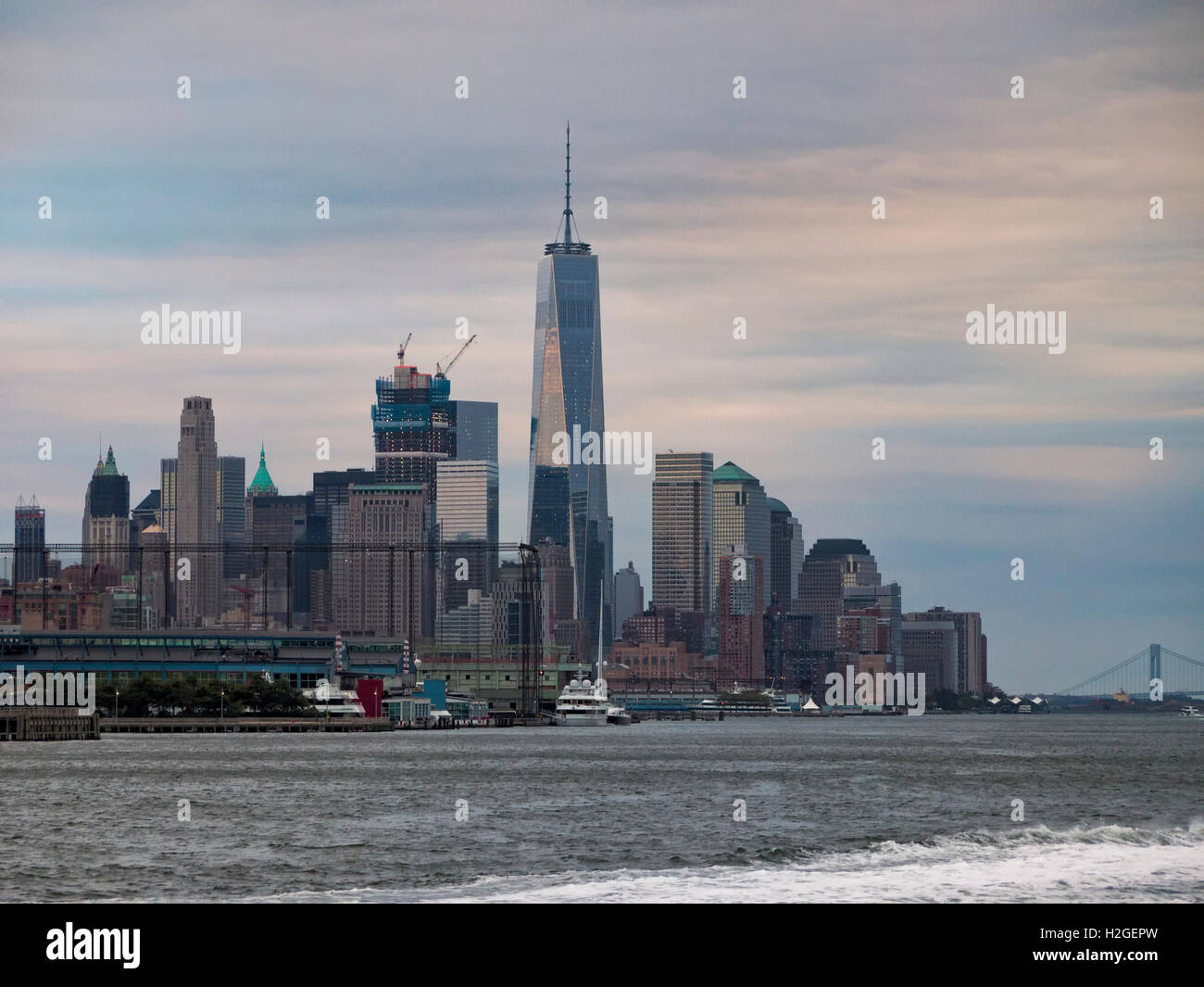 Lower Manhattan New York City skyline with the Freedom Tower, One World Trade Center, at twilight Hudson River wide angle view Stock Photo