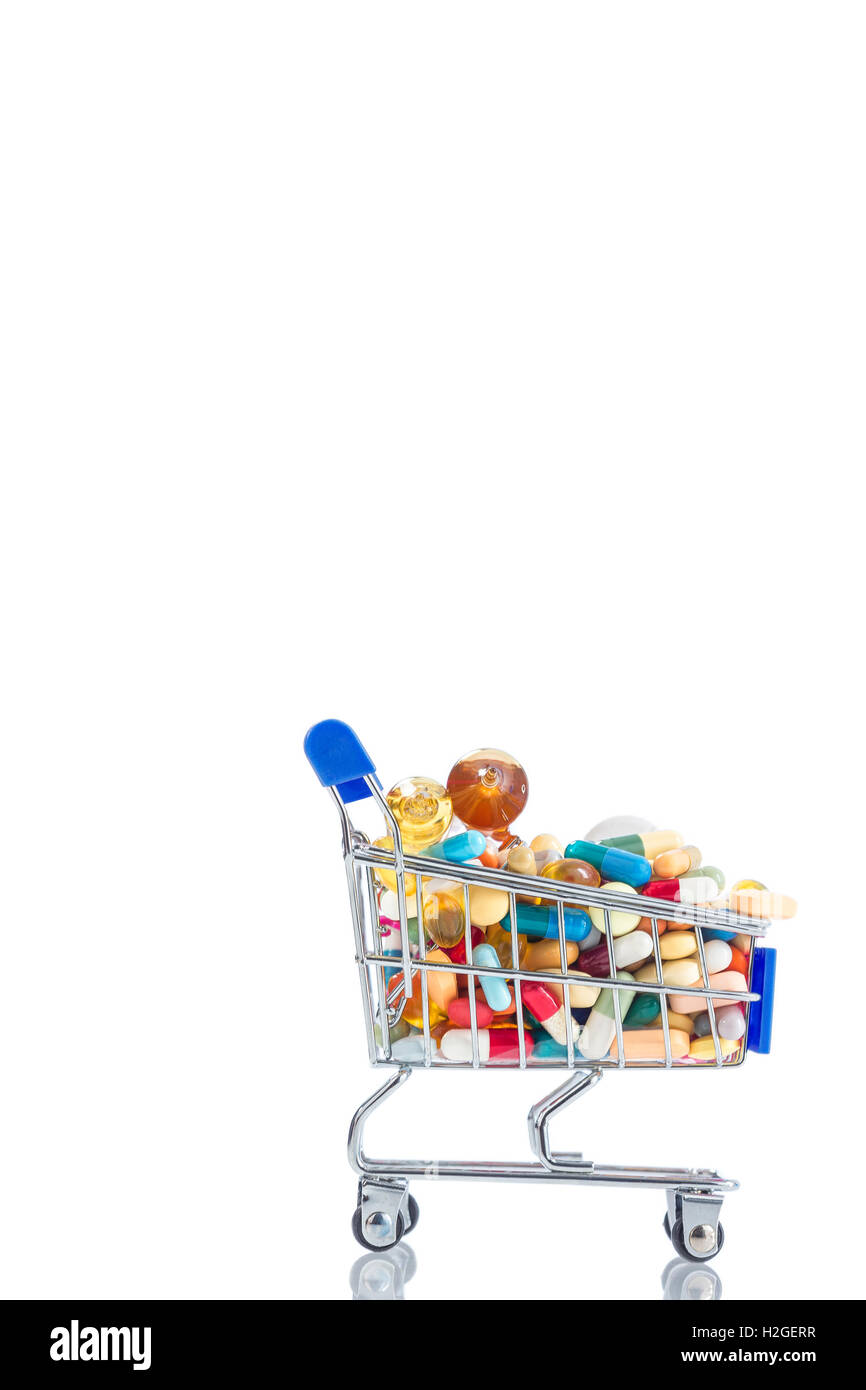 Isolated shopping cart full of medicine with pills and capsules Stock